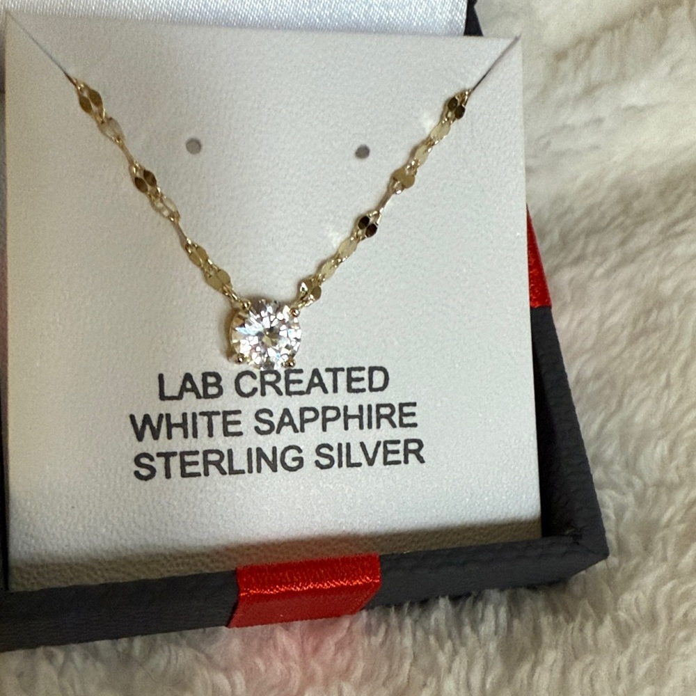 Sterling silver Lab created white sapphire necklace yellow gold plated.